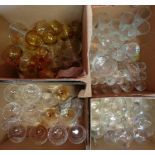 Four boxes containing a large quantity of drinking glasses including Edinburgh Crystal, Babycham,