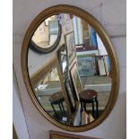 A Georgian style gilt framed oval wall mirror