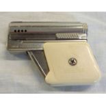 A vintage IMCO gun cigarette lighter