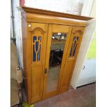 A 3' 3" Edwardian satin walnut single wardrobe with hanging space enclosed by a bevelled mirrored