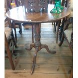 A 25 1/2" diameter 19th Century mahogany pedestal table, set on turned pillar and tripod base -