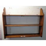 A 31" old stained pine three shelf wall unit with shaped sides