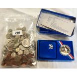 A collection of US coinage including a Shield Nickel, two Philippines Administration 20 Centavos,