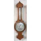 An early 20th Century polished oak cased banjo barometer/thermometer with silvered style dial marked