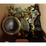 Assorted copper and brassware including candlesticks, bells, horse brasses, etc.