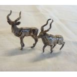 A pair of vintage South African hallmarked white metal antelope