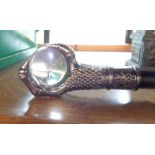 A modern reproduction walking stick with glass ball and metal claw top