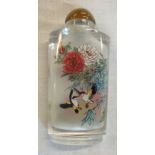 A Chinese glass snuff bottle reverse painted with birds amidst flowers and foliage