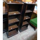 A pair of 14 3/4" reproduction mahogany four shelf open bookcases with plinth bases