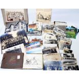 A small collection of early to mid 20th Century postcards and group shot photographs - sold with a