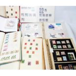 Two albums containing FDCs and mint stamps - sold with a small box containing loose stamps on paper,
