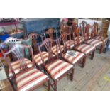 A set of twelve reproduction mahogany framed dining chairs in the antique style with pierced splat