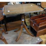 A reproduction mahogany tilt-top pedestal wine table, set on turned pillar and quadruple splayed