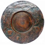 A large German Arts and Crafts hand beaten and repousse copper tray with sea creature and