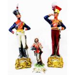 Two Capo Di Monte continental soldier figures and a scroll - sold with a smaller figure - minor