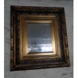 A reproduction gilt framed oblong wall mirror in the antique style with bevelled plate, gilt slip