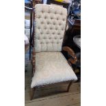 A reproduction mahogany part show frame drawing room armchair in the antique style with button