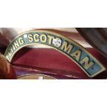 A reproduction painted cast iron Flying Scotsman sign