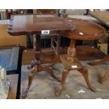 A 17" reproduction mahogany and mixed wood pedestal table with oval top, set on turned pillar and