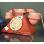 A vintage tin plate and plastic toy telephone
