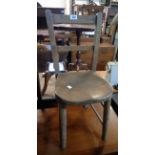 A vintage child's school chair with moulded solid elm seat and simple turned supports - stains and