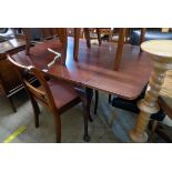 A 4' 11 1/2" stained wood draw-leaf dining table, set on cabriole legs with pad feet - top