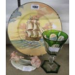 A Royal Doulton Famous Ships plate depicting the Victory, a porcelain fairing depicting three little