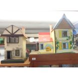 A vintage Mock Tudor dolls house and another vintage example