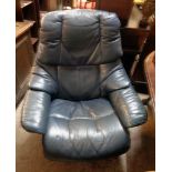 A modern blue leather upholstered reclining easy chair with polished wood bentwood part show frame