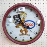 A reproduction painted tin cased Esso advertising clock with battery movement