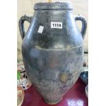 An old glazed two handled amphora shaped pot