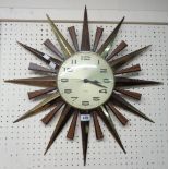 A 24" Metamec Sunburst pattern wall clock with quartz movement