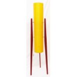 A retro freestanding rocket lamp with amber coloured fibreglass tubular shade, set on triple stained
