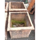 A pair of large terracotta planters