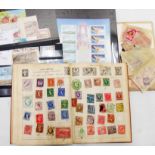 A schoolboy album containing hinge mounted mainly 20th Century world stamp contents, some