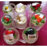 A quantity of preserve pots and condiments with encapsulated lucite lids