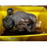 A box containing assorted Oriental resin figures