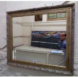 An ornate gilt framed oblong wall mirror