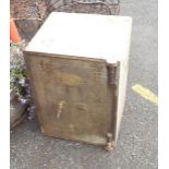 An antique safe by Otton & Sons Ltd of Exeter, with brass fittings