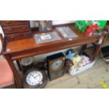 A 4' 6 1/2" reproduction mahogany console table with decorative pierced gallery and panelled