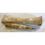 An African animal leg bone with carved figural decoration - sold with a resin reproduction