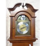 A 20th Century Artime reproduction walnut longcase clock with glazed door to trunk and triple weight
