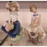 Two Lladro figures of a girl with a cat (with box) and a girl with a basket