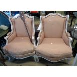 A pair of 20th Century French style fauteuil armchairs with shabby chic painted part show frames and