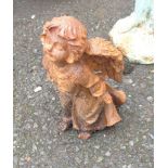 A small cast iron garden angel