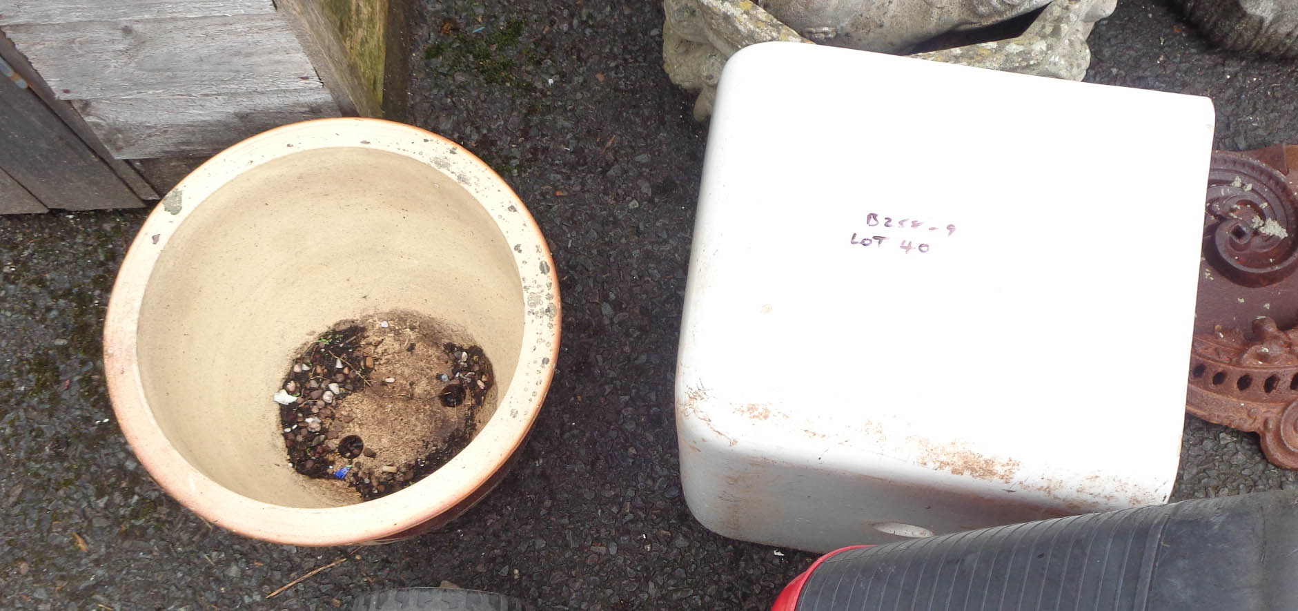 A D-shaped Belfast sink - sold with a large plant pot