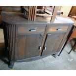 A 4' Art Deco oak and mixed wood sideboard with reeded curved front corners, two short drawers and