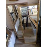 Two modern framed oblong wall mirrors