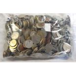 A bag containing a collection of world coinage