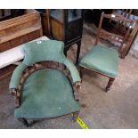 An Edwardian stained oak framed bow elbow chair with spindle decoration and remains of green cord